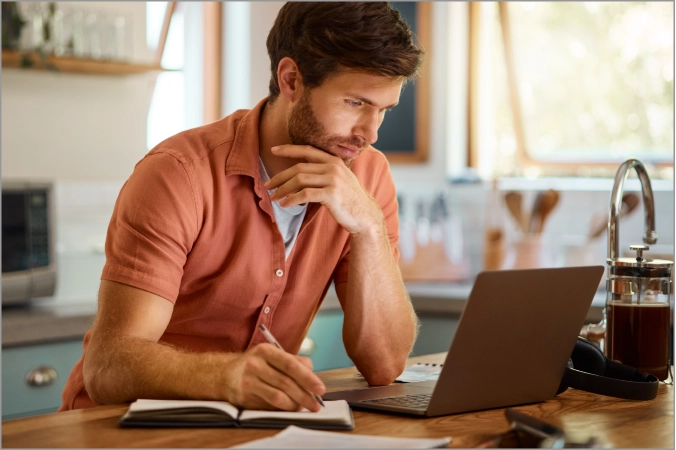 blog-img Serious man looking into laptop | Floors In Motion
